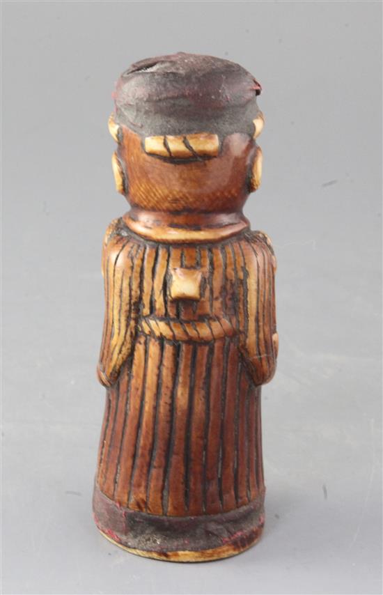 A late 19th century Benin carved ivory figure of a priest, height 6.5in.
